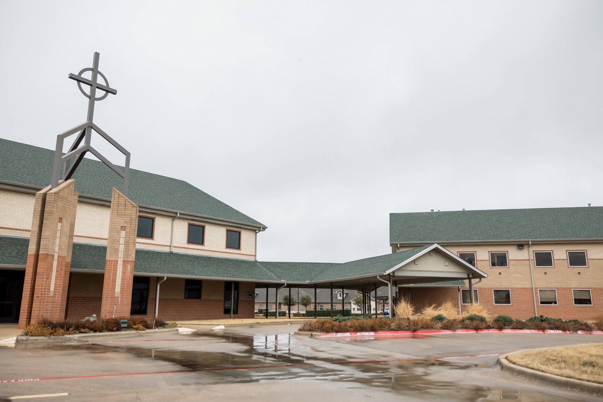 Exterior view of Reformed Theological Seminary Dallas campus building with cross tower and entrance canopy