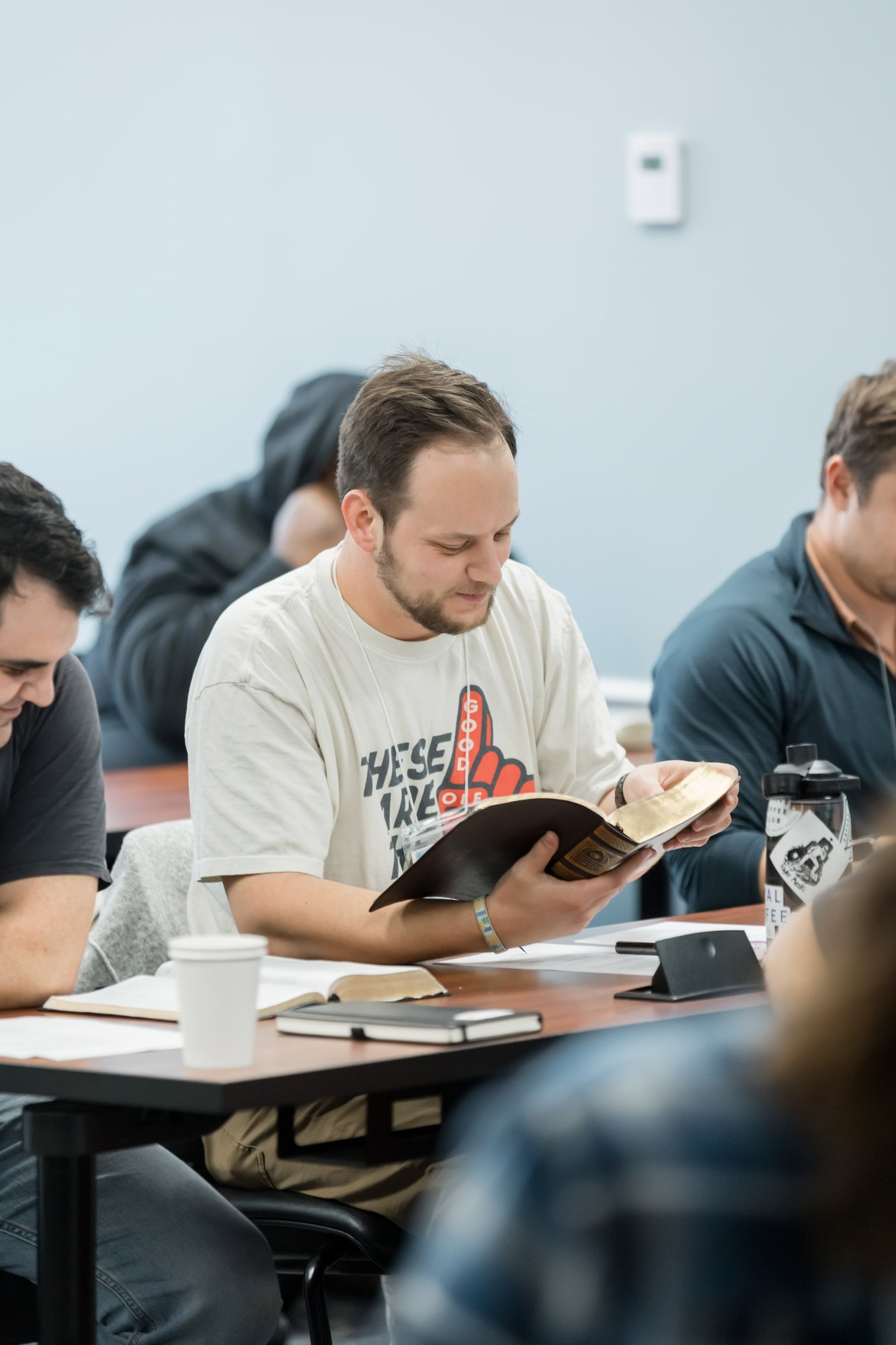 Student reading a Bible during class in Orlando.