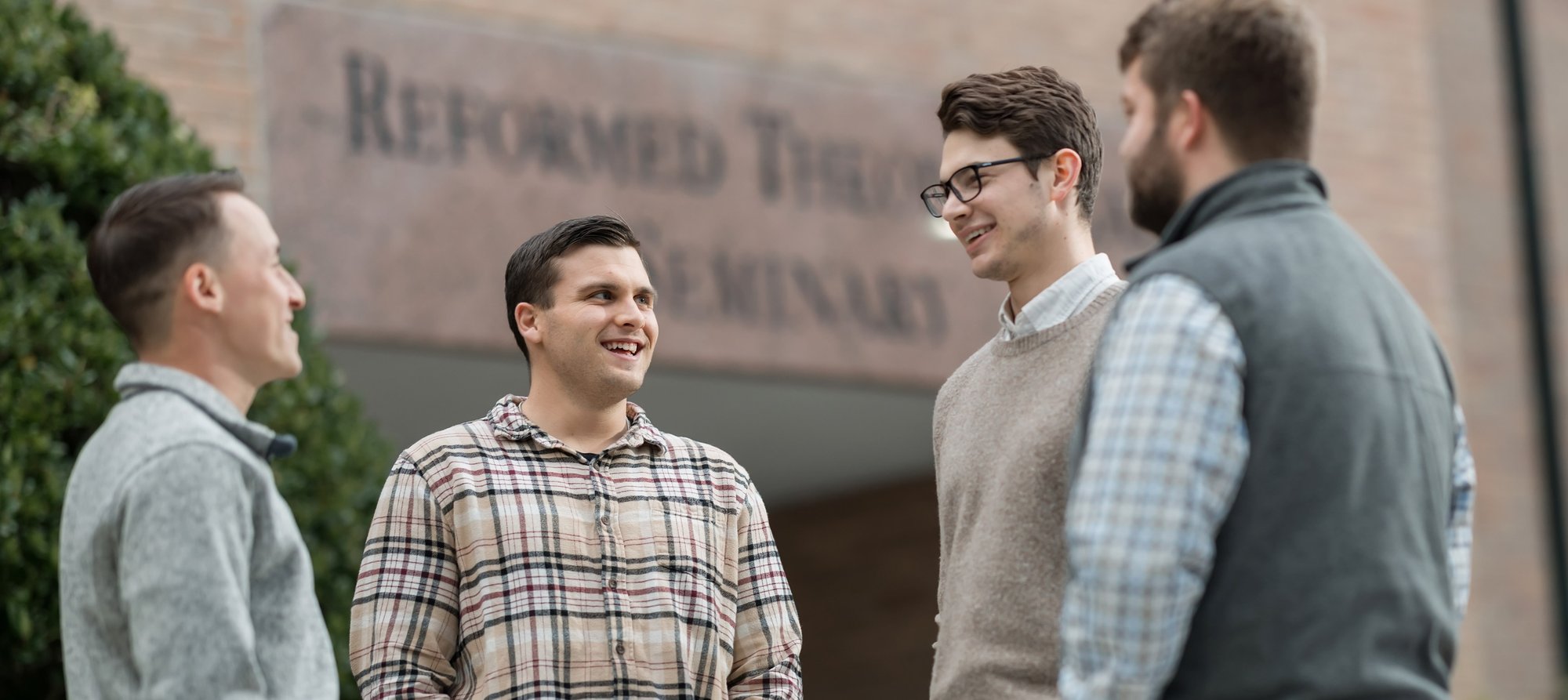 Students talking together outdoors on the Orlando campus.
