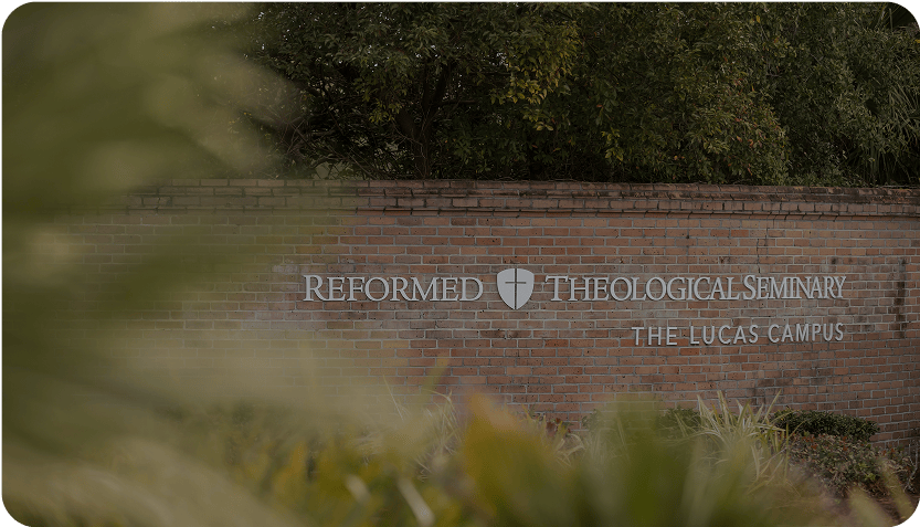 RTS Orlando campus sign on a brick wall.