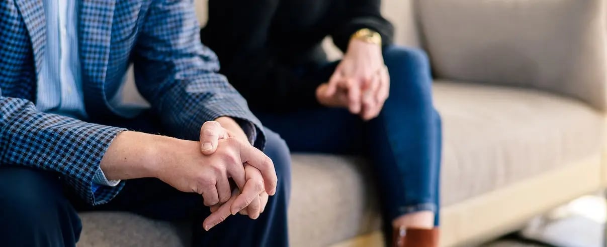folded hands in counseling session header
