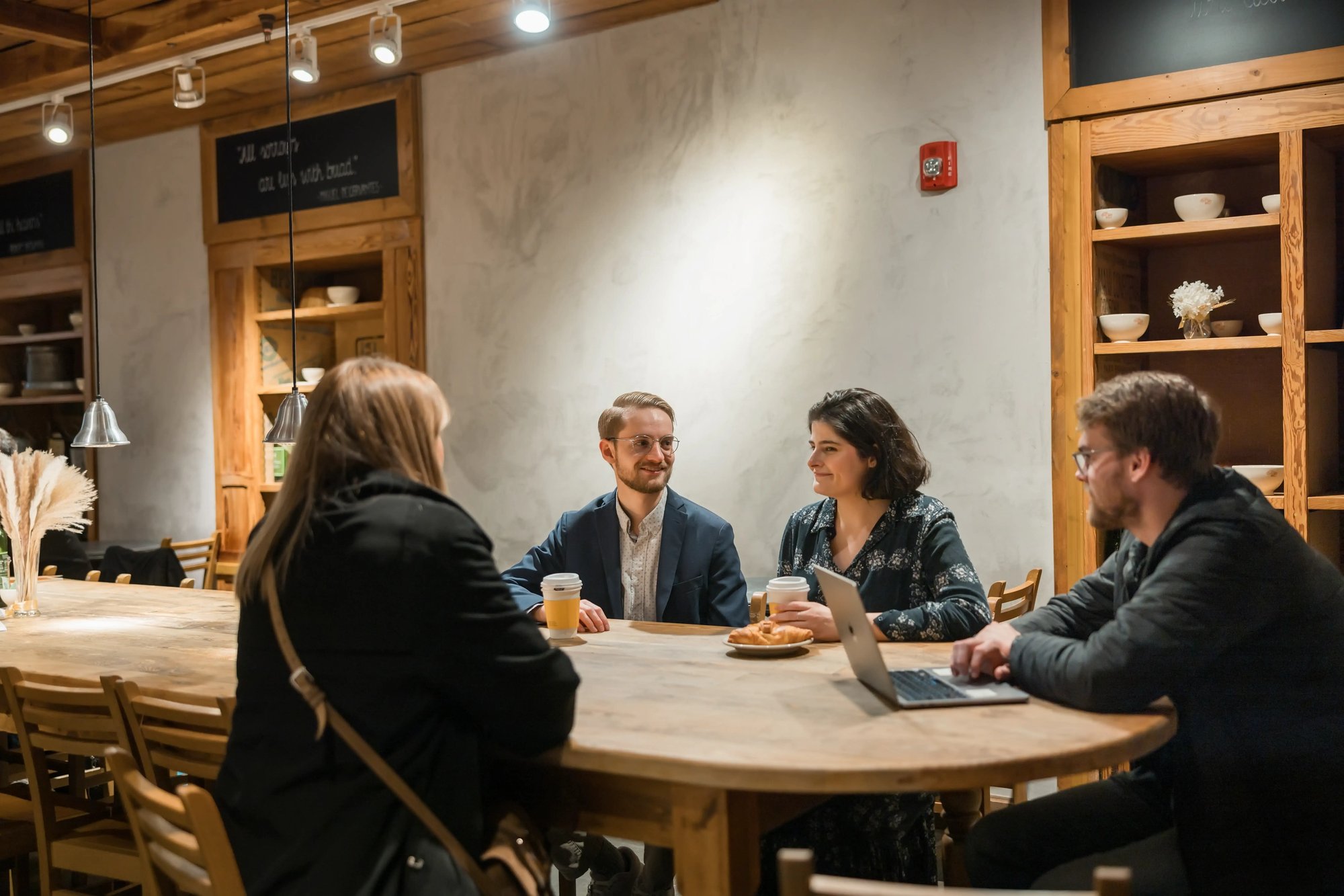 Students of RTS NYC in a coffee shop smiling