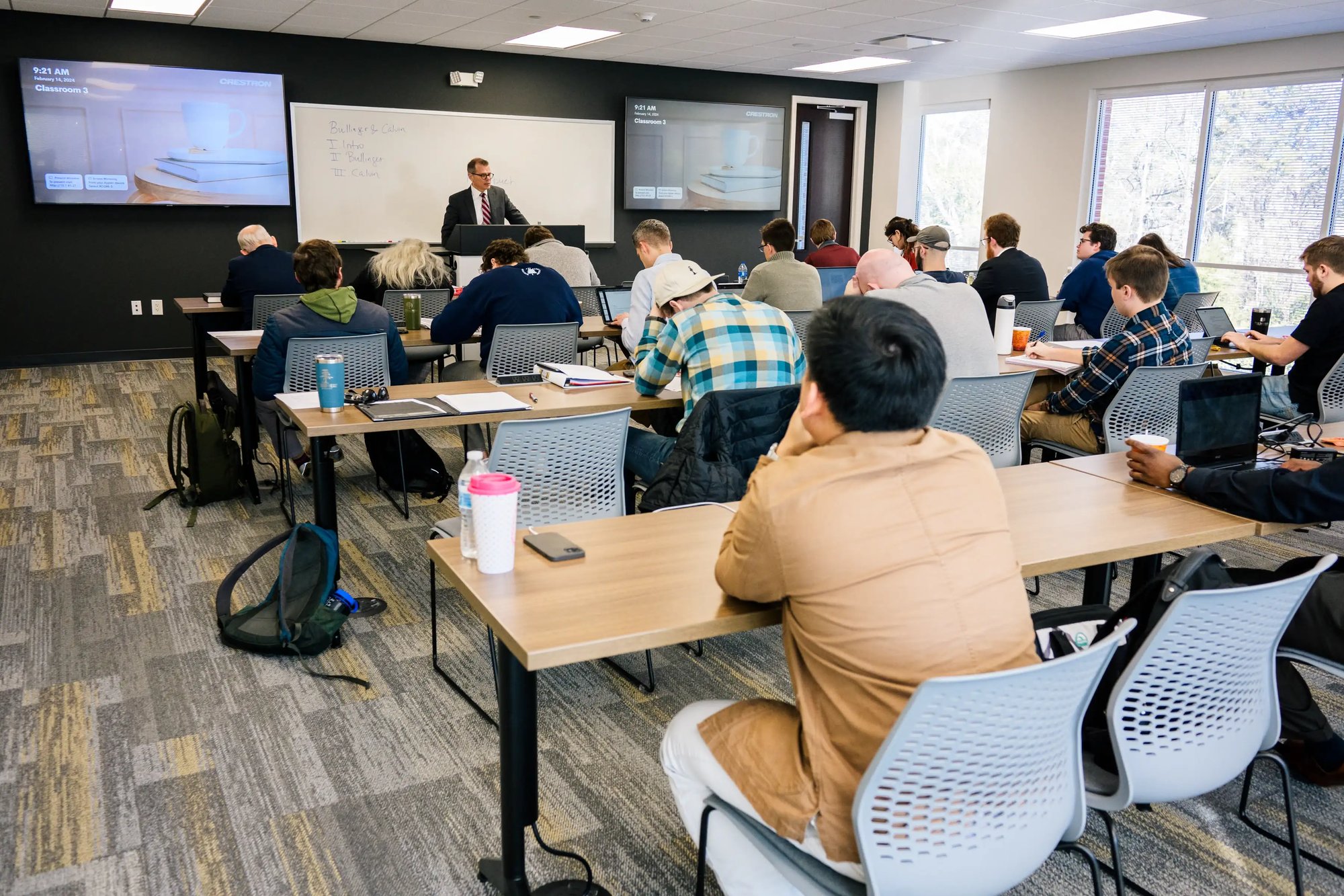 room full of students learning in a classroom