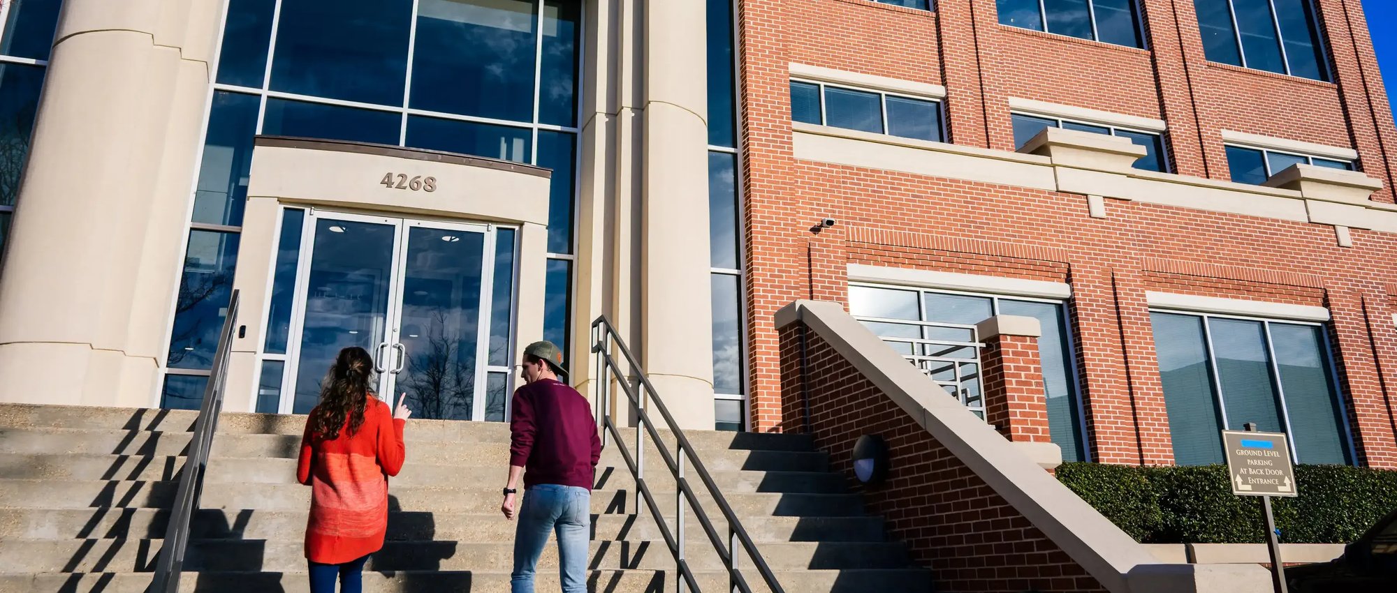 Students walking into the RTS campus building entrance.