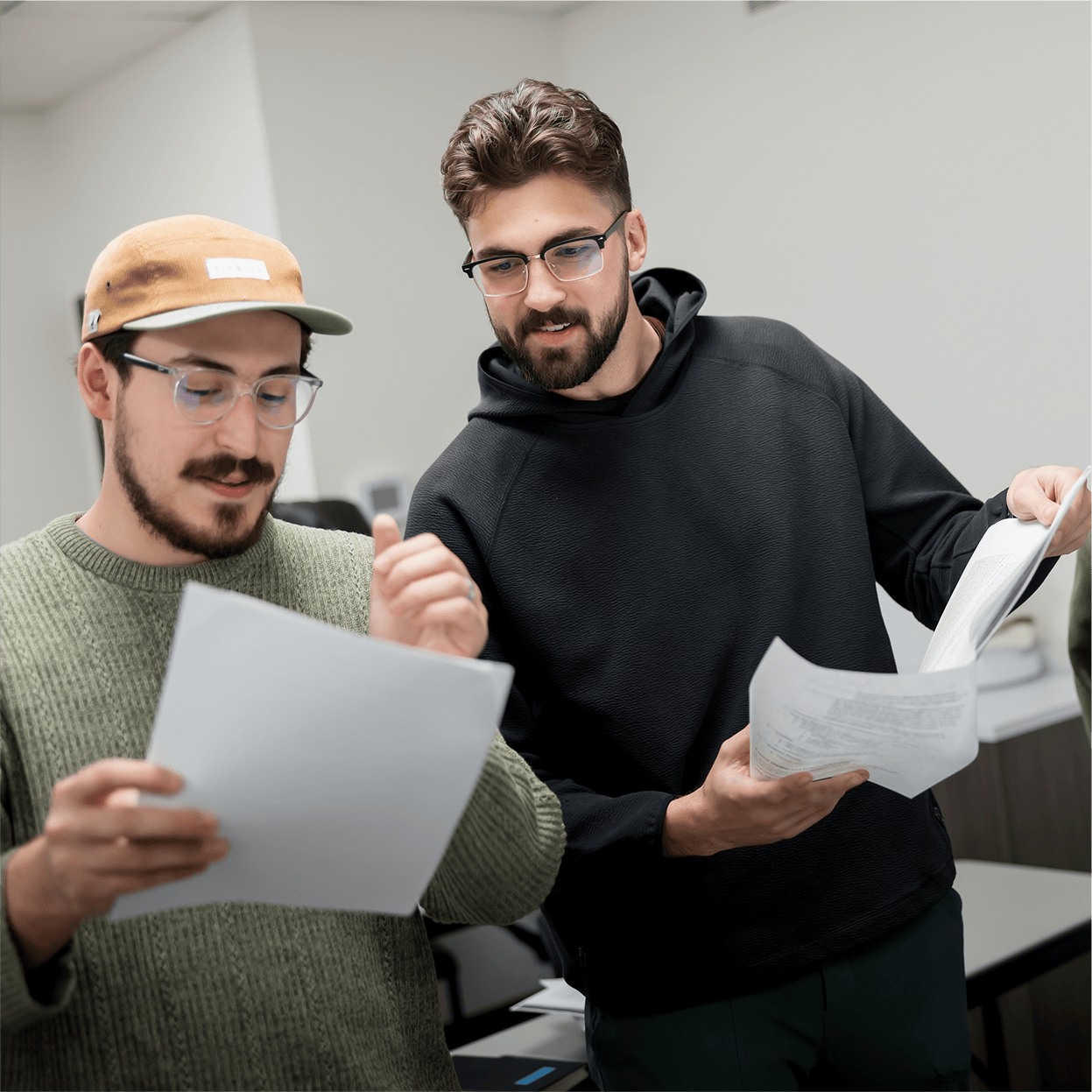 Two students looking at paperwork